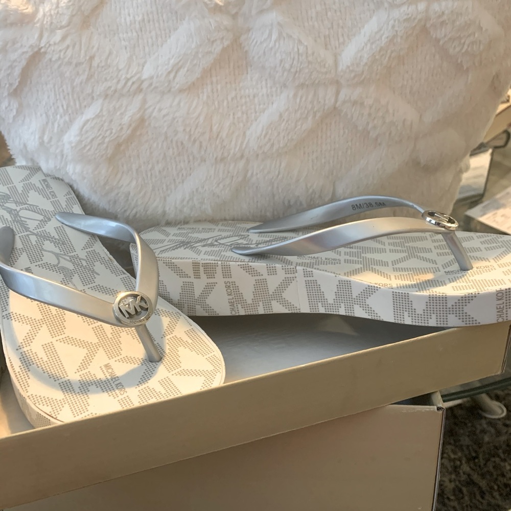 Michael Kors Flip Flop sandals.